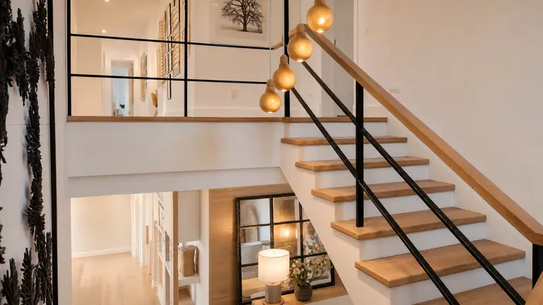 Warm modern interior staircase representing a secure future
